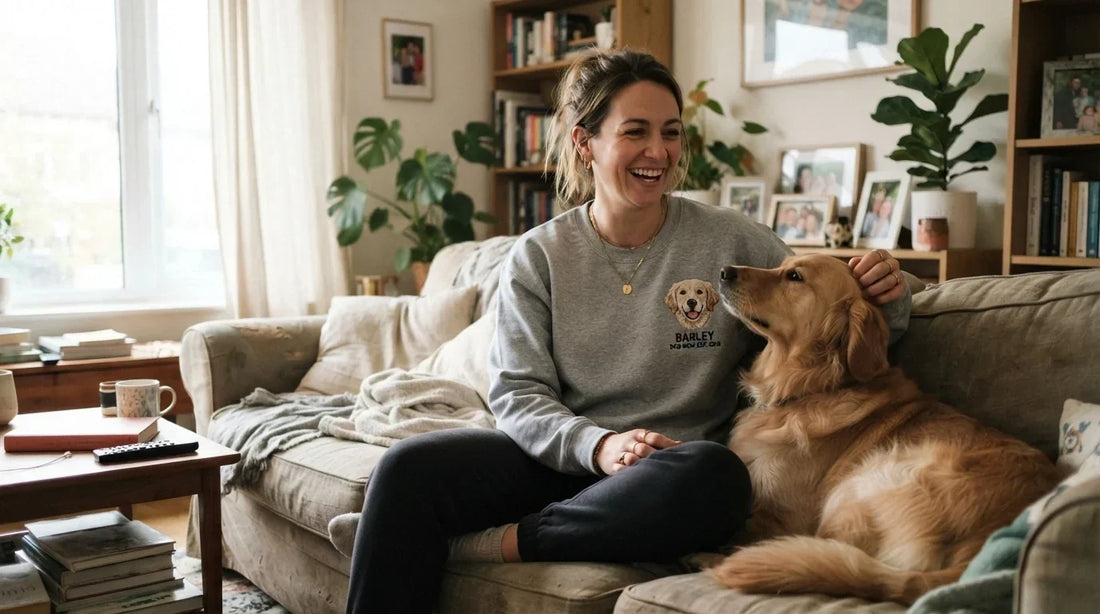 Dog mom wearing custom pet embroidered sweatshirt at home.