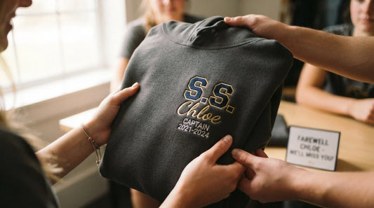 Custom embroidered farewell hoodie with name and team initials.