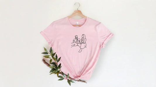 Line drawing embroidery on t-shirt.